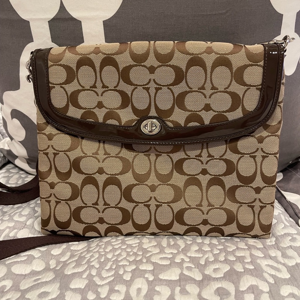Barely used Coach iPad or laptop bag. Can function as crossbody too.
